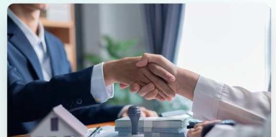 Agent shaking hands with client